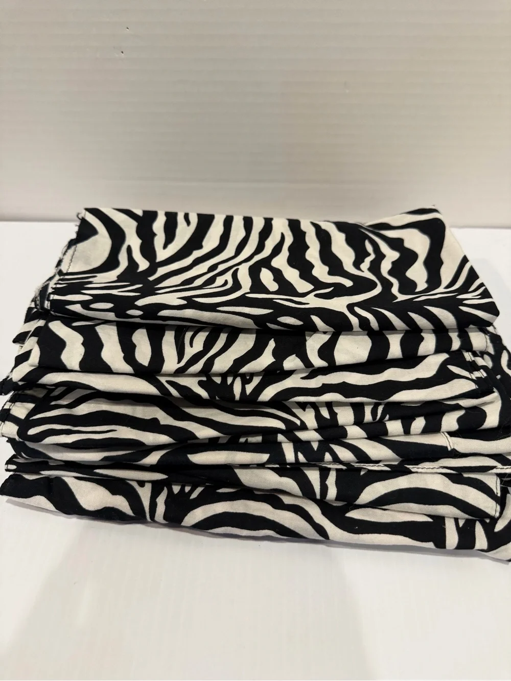 Set of 13 cotton 20x20” Zebra Print Napkins, Black & White, used for a party.